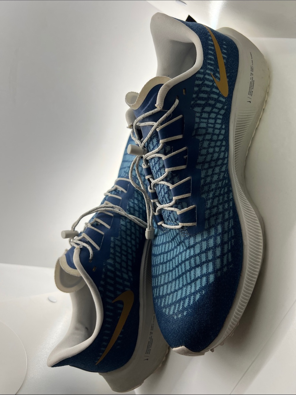 Nike Men’s Blue Sneakers with Gold Swoosh